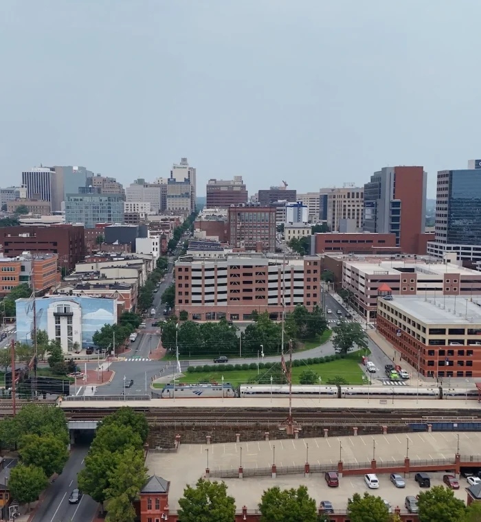 Wilmington, Delaware cityscape featuring downtown buildings, streets, and greenery, representing the area served by Nova Locksmith's emergency locksmith services.