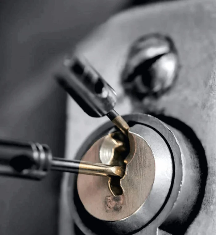 Locksmith tools in action on a business lock, demonstrating professional lockout service for commercial properties.