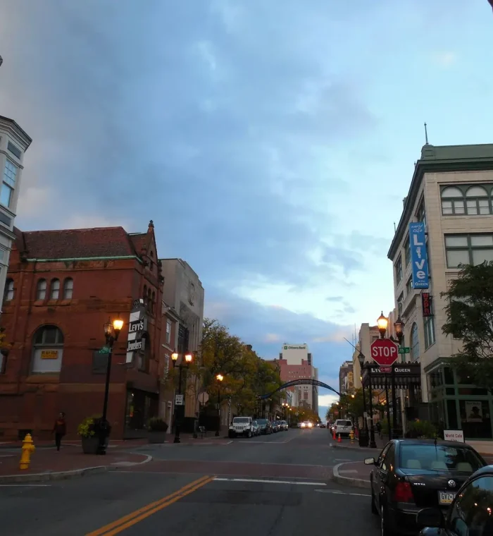 Street view of downtown North Star, DE, featuring historic buildings, a stop sign, and a blue archway, highlighting the local urban landscape relevant to Nova Locksmith's services.